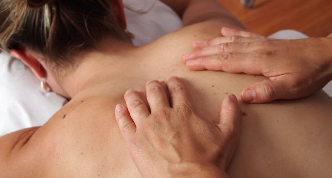 Woman recieving a Therapeutic Swedish Massage Therapy